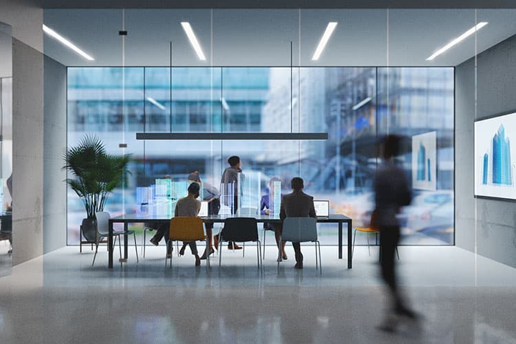 Mehrere Arbeitspersonen in einem futuristisch anmutenden Büro