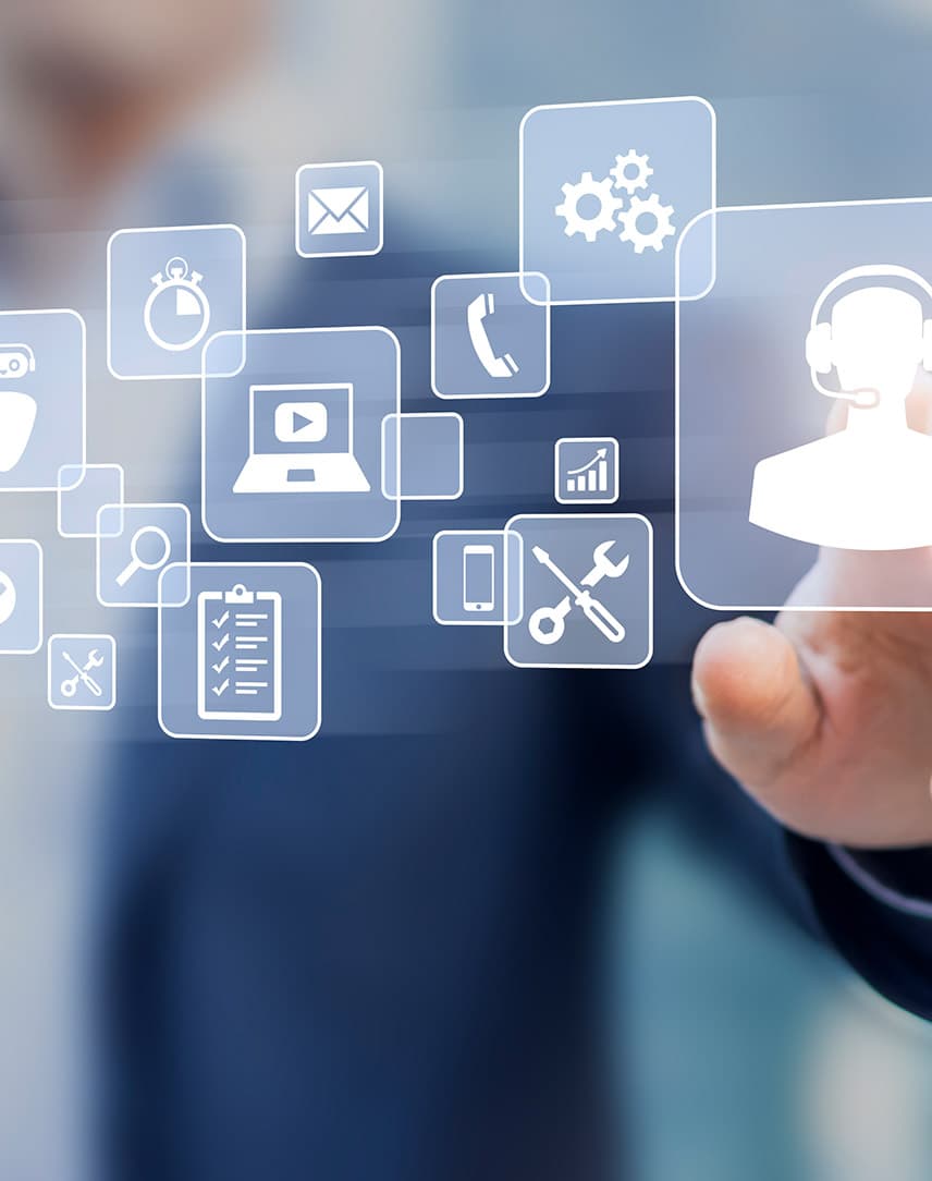 Icons, die die digitalisierte Welt der IP-Telefonie dartellen, dahinter eine Hand eines Mannes im Anzug, der auf ein Icon einer Person mit Headset zeigt