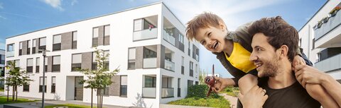 EWE business Wärme für Kommunen Ein weißes Mehrfamilienhaus, im Vordergrund ein Vater mit seinem Sohn auf den Schultern